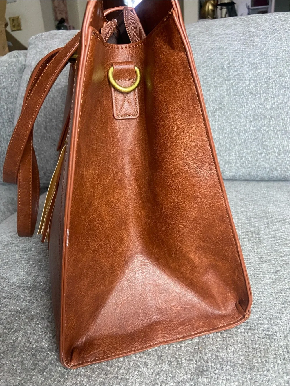 Leather-Textured Tan Tote with Tassel Accent for laptop work